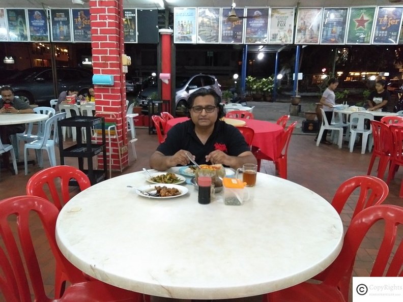 Ozasiatraveller enjoying great food at Haitian Restaurant