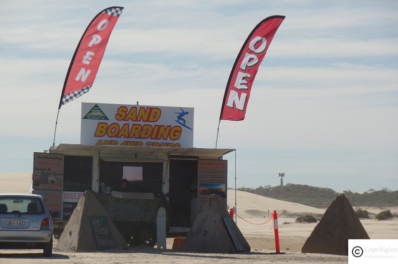 Join a sand boarding adenture with a desert safari