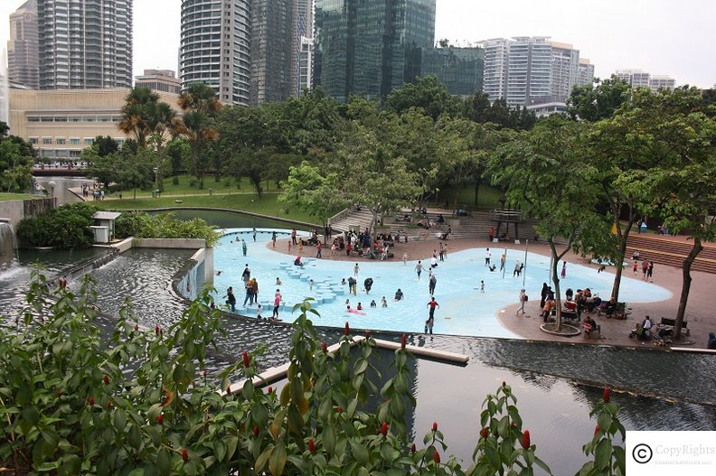 Beating the summer heats in the fountains in KLCC Park 